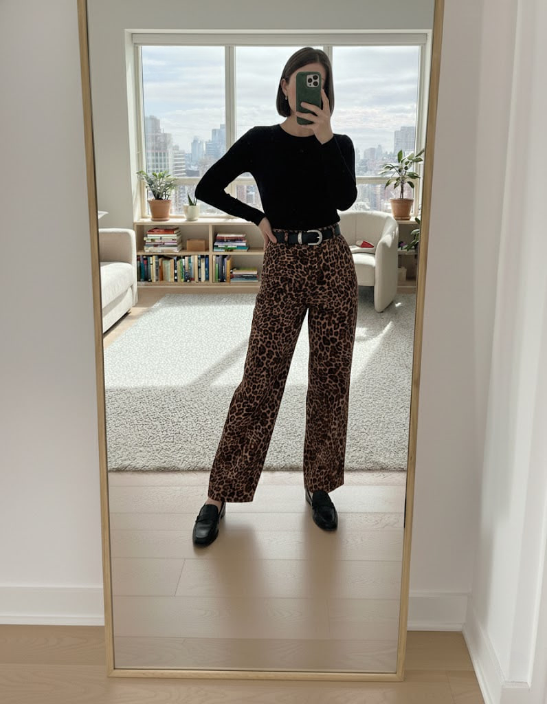 Leopard print wide-leg pants with black top and chunky loafers